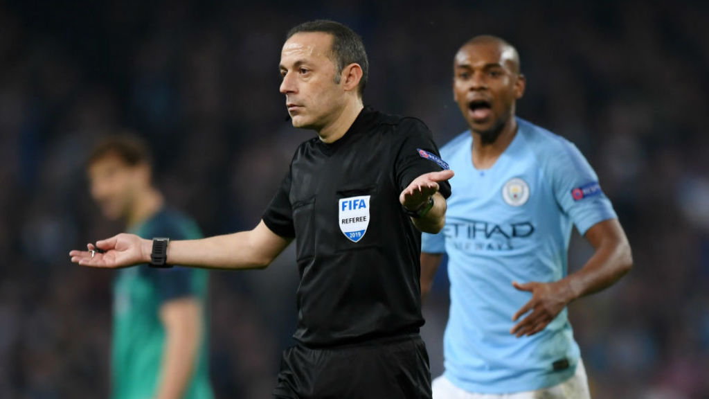 SHATERING BLOW : Referee Cuneyt Cakir signals offside for Raheem's late, late effort after consulting VAR