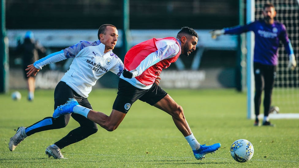 CATCH ME IF YOU CAN : Mahrez looks to shrug off Angelino.