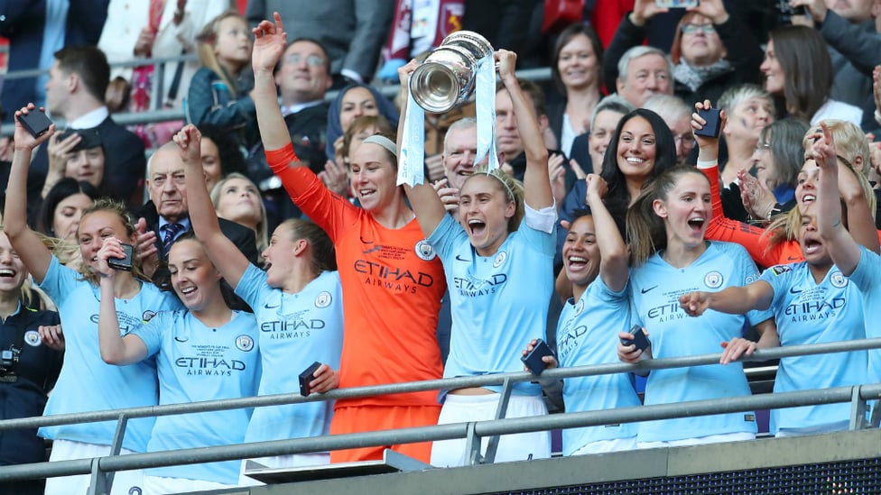 UP FOR THE CUP : Skipper Steph Houghton hoists the FA Cup aloft