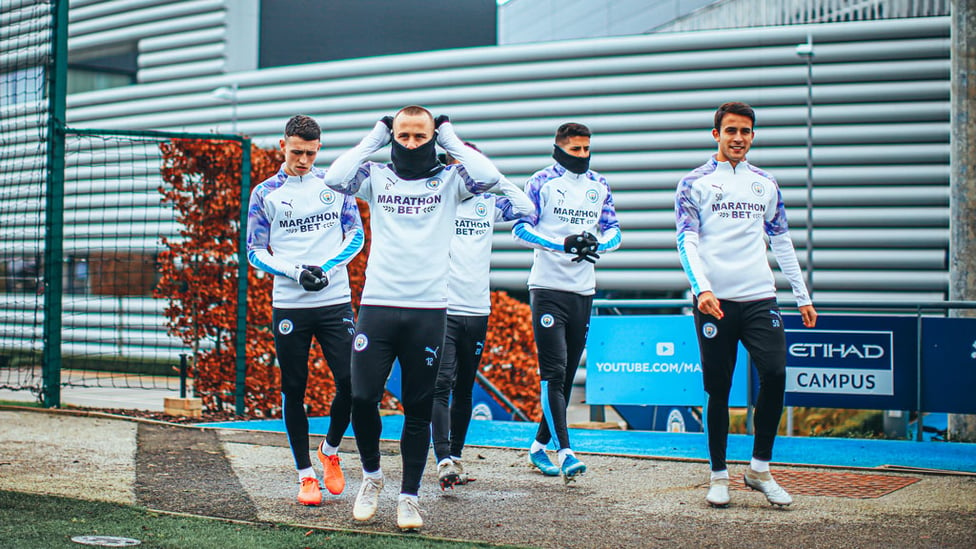 BOYS IN THE SNOOD! : The City players were dressed to keep out the January chill