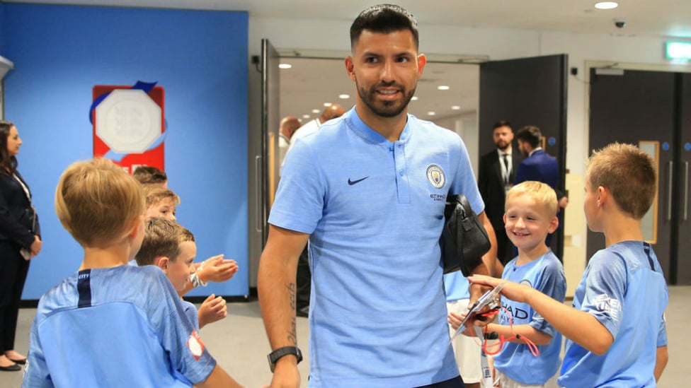 READY TO RUMBLE : Sergio Aguero greets some of the City mascots as he arrives at Wembley