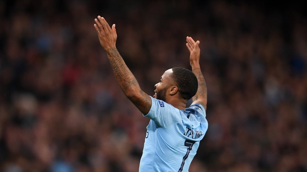 GOALDEN BOY : Raheem take the crowd's acclaim after curling home the third of the night