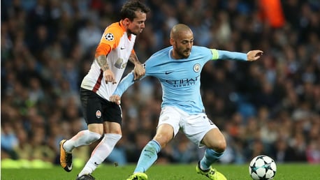 AT FULL STRETCH: David Silva battles it out against Shakhtar Doneskt