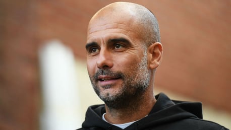 THE BOSS: Pep looks in relaxed mood as he arrives at Selhurst Park. 