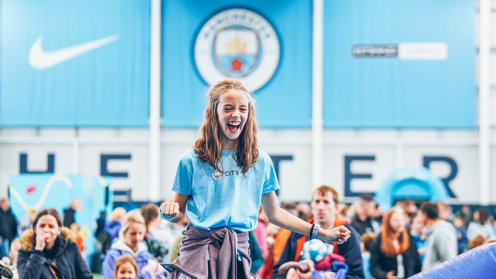 ALL SMILES : One young fan can hardly contain her emotion