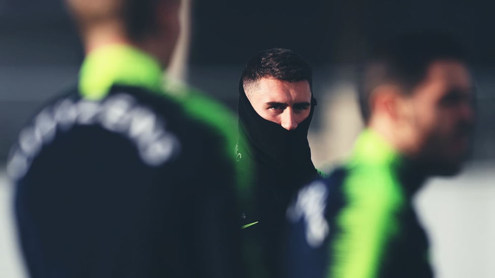 BOYS IN THE SNOOD : Aymeric Laporte is covered up to keep out the winter chill