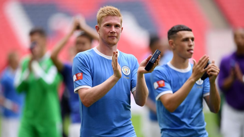 MASTER AND APPRENTICE : Kevin de Bruyne and Phil Foden salute City's supporters at Wembley.