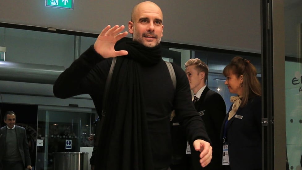 SMILE AND WAVE : The boss looks happy as he arrives at the Etihad.